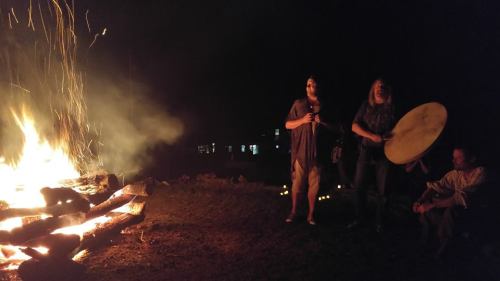 Kris and Damh singing at the fire circle.